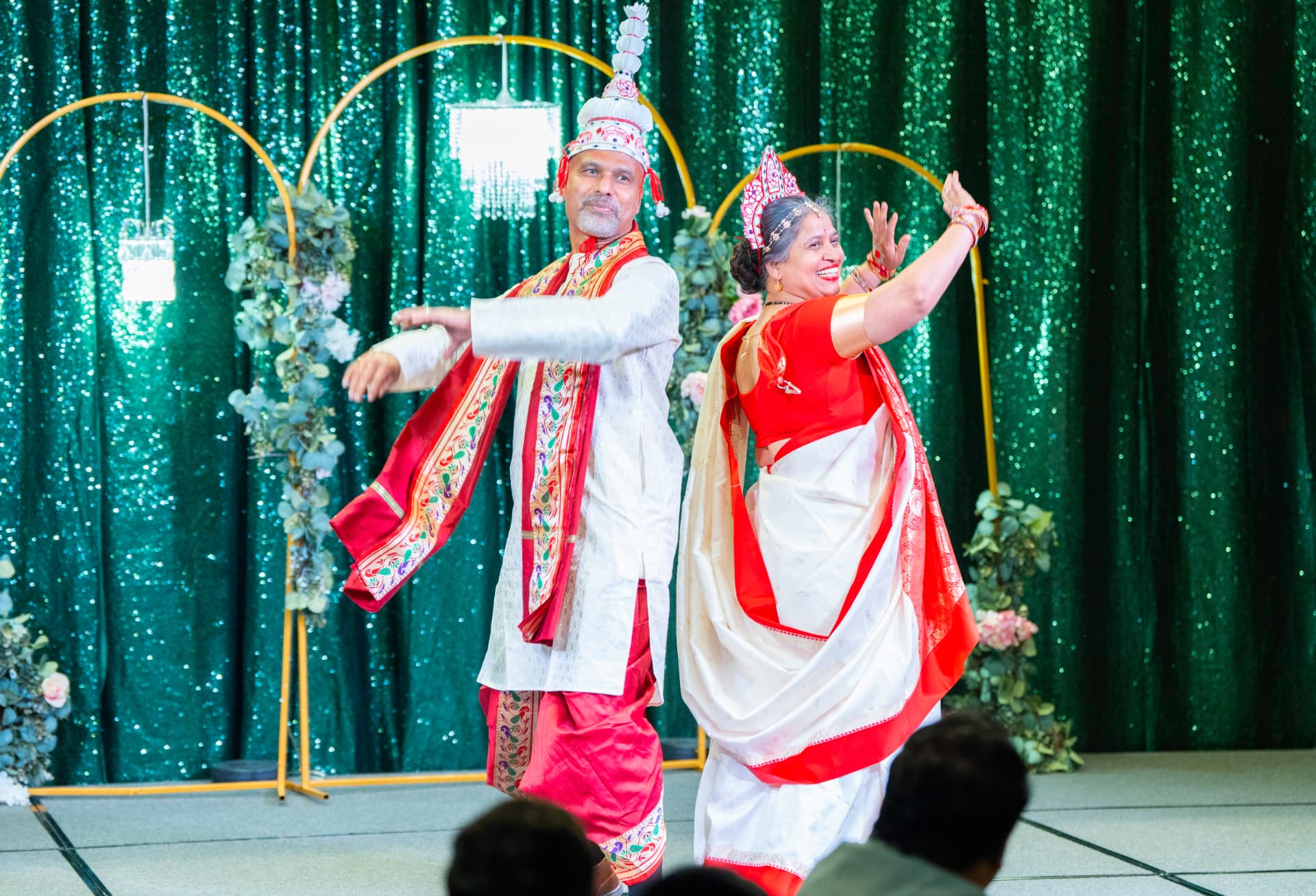 A couple in traditional dress performs a dance at Taste of India 2026