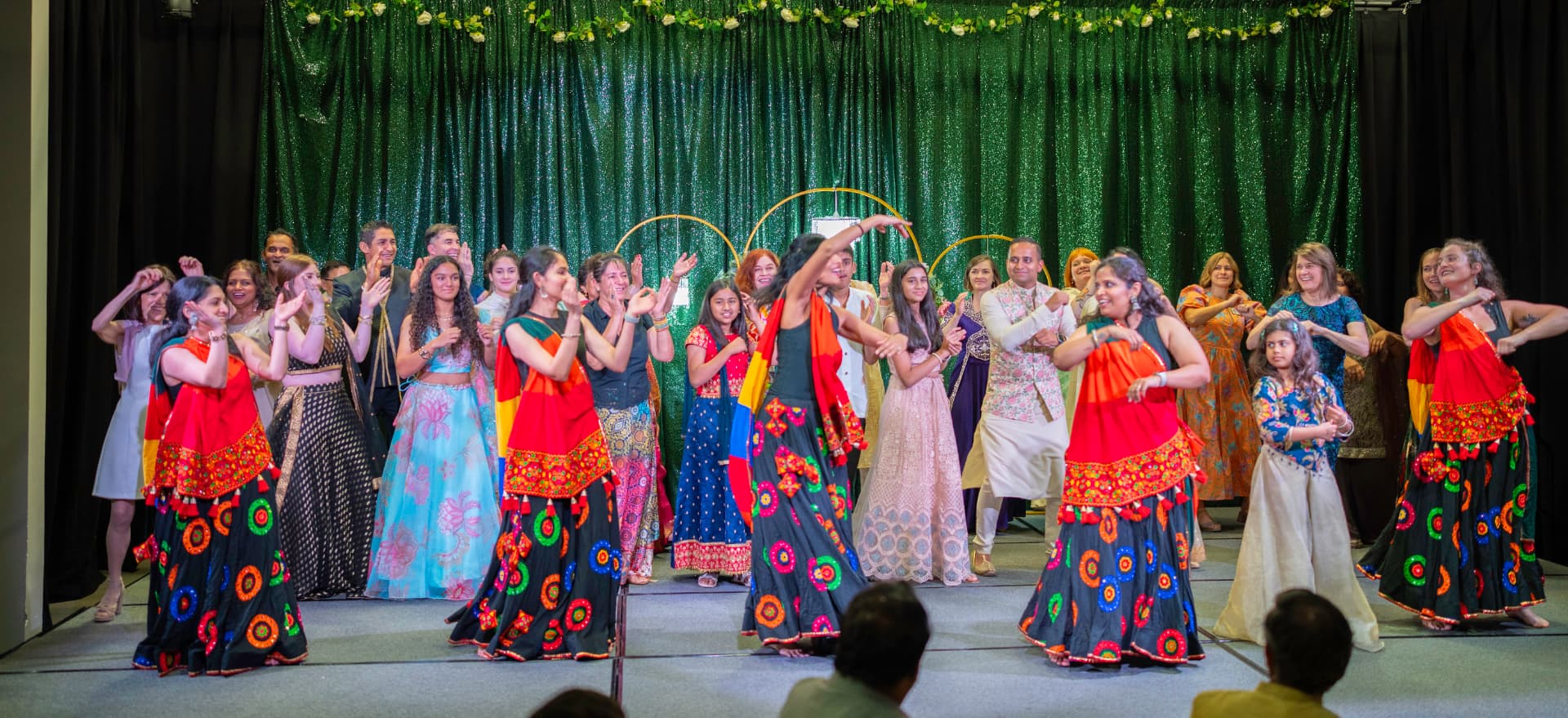 Community members dance together in vibrant traditional attire at Taste of India 2026